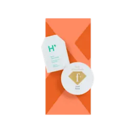 The image depicts the Expack 0.02oz PE Standup Pouch (PCR) UniShape Die-Cut 0.5ml. The pouch is small, clear, and features a unique die-cut shape, making it stand out. It has a flat bottom allowing it to stand upright and a sealed top. The material appears smooth and transparent, showcasing the minimalist design of the packaging. 