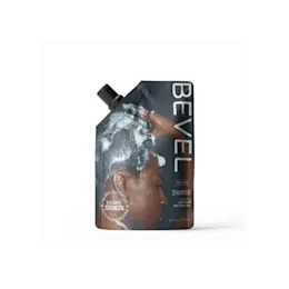 The image showcases the Expack 10 1oz PE Pouch with PCR UniSpout 300ml. The pouch is a flexible, transparent plastic container with a clear appearance, allowing visibility of its contents. It features a spout at the top for easy pouring and resealing. The pouch stands upright, and the spout is situated on the top left corner. There are no labels or additional markings on the pouch, giving it a clean and minimalistic look.