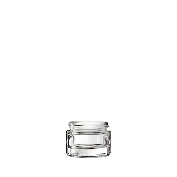 The image displays the Calaso 1.0oz Glass Jar, model HD14150-100. The jar is clear and cylindrical with smooth, straight sides and a flat, round base. The jar has a wide mouth, making it suitable for easy filling and dispensing of contents. The glass appears to be thick and sturdy, providing a high-quality look and feel to the product. There is no lid shown in the image. The overall appearance is sleek and minimalist, ideal for various uses such as cosmetics, creams, or other small quantities of products.