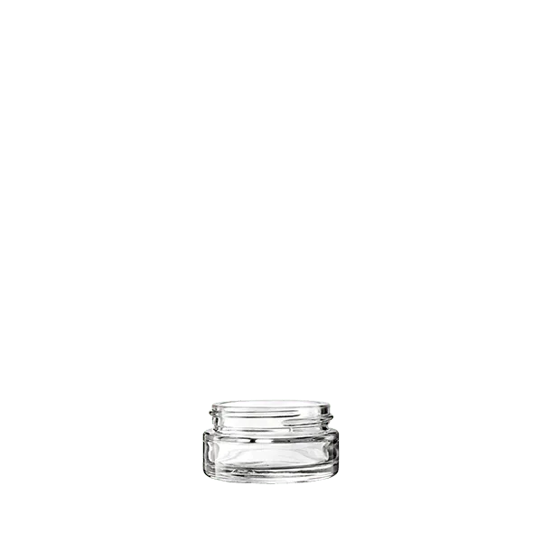 The image shows a clear, empty glass jar with a cylindrical shape. The jar has a smooth surface and a wide mouth with a threaded neck designed for a screw-on lid, which is not shown in the image. The glass is transparent, allowing full visibility of its contents. This product is identified as the "Calaso 1.0oz Glass Jar."