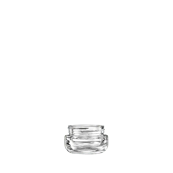 The image features the Calaso 1.0oz Glass Jar HM14010-100. The jar is clear and cylindrical with a smooth, seamless surface. It has a wide, round opening at the top, making it suitable for storing creams, balms, or other small quantities of products. The glass appears thick and sturdy, providing a high-quality look and feel. The jar does not have any labels or markings, showcasing its clean and minimalist design.