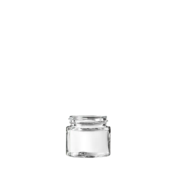 The image shows the Calaso 1.0oz Glass Jar by Glasmeister. The jar is made of clear glass, allowing the contents to be visible. It has a cylindrical shape with a wide mouth, making it suitable for storing creams, balms, or other cosmetic products. The jar is topped with a screw-on lid, which appears to be made of a matte black material. This clean and minimalist design offers both functionality and aesthetic appeal.