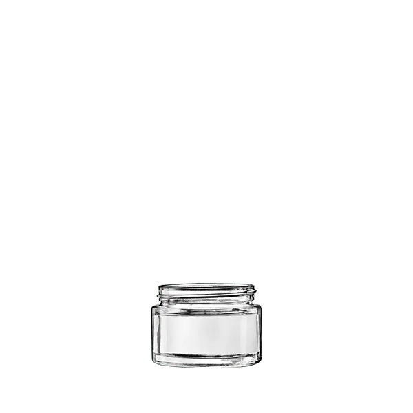 The image shows the Calaso 1.7oz Glass Jar by Glasmeister. The jar is clear and cylindrical with smooth, slightly rounded edges. The glass is transparent, allowing the contents inside to be visible. The jar features a wide mouth opening, suitable for easy filling and dispensing of products. The overall design is sleek and minimalist, making it ideal for a variety of uses such as cosmetics, creams, or other small items.