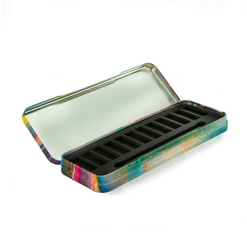The image shows the APG Packaging 0.0oz Mixed Material Compact (APG-161). This product is a sleek, circular compact with a glossy black finish. The compact features a smooth, reflective surface on the top lid and a secure closure mechanism. The compact is designed to hold cosmetic products, with an interior that likely includes a mirror and a compartment for makeup. The overall design is minimalistic and elegant, making it suitable for both personal and professional use.