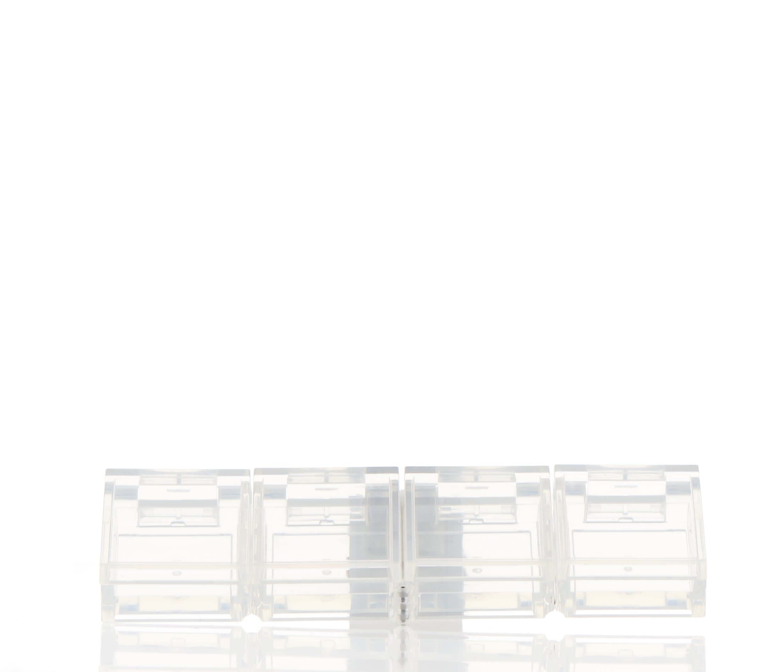 The image shows the APG Packaging 0.0oz PETG Compact (APG-400015). The compact is circular with a clear, transparent lid that allows the contents to be visible. The base of the compact is also clear, showcasing a sleek and minimalist design. The overall appearance is clean and modern, suitable for holding cosmetic products like powders or creams.