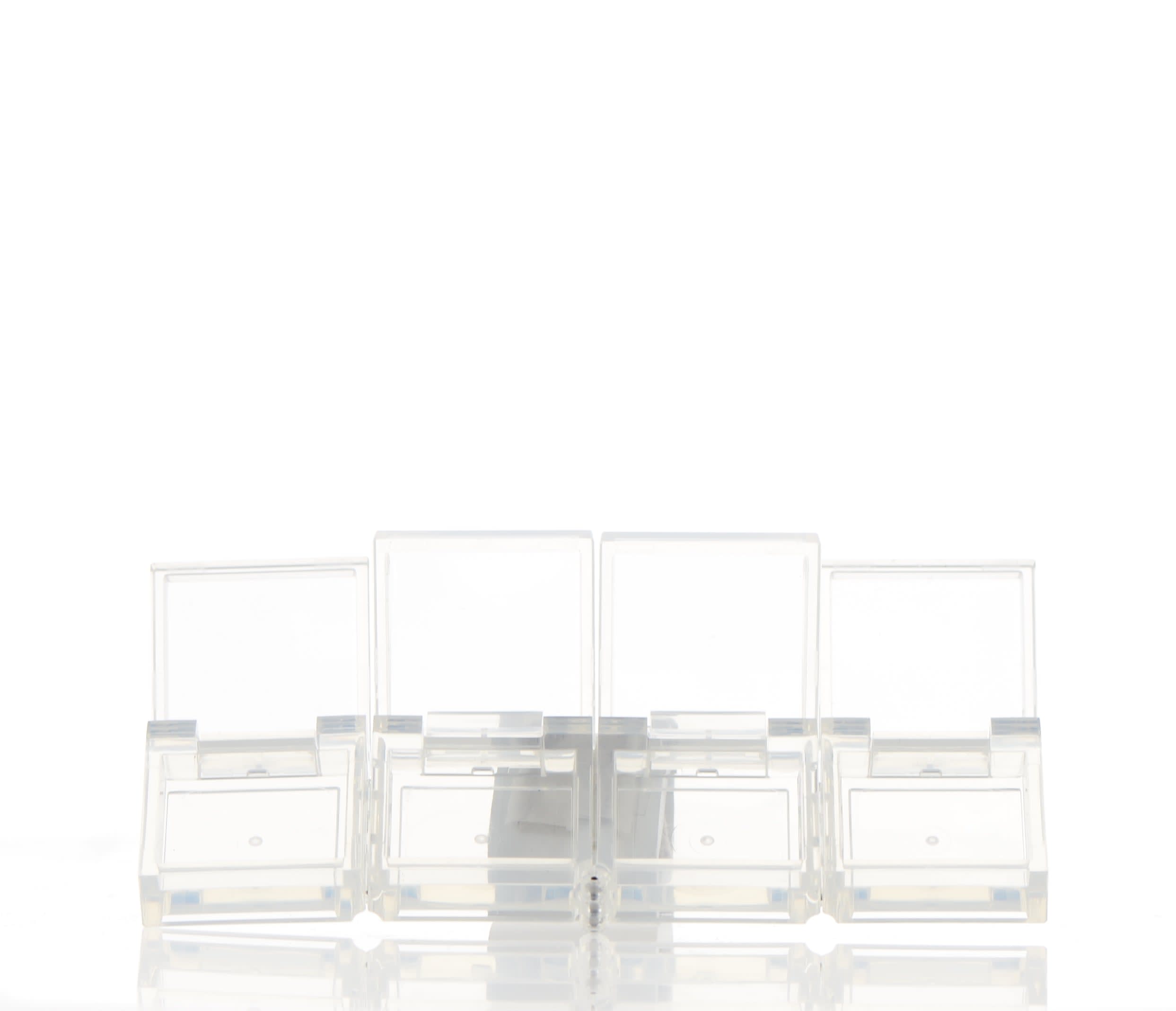 The image shows a compact container with a clear base and a shiny, metallic gold lid. The base is made of transparent plastic, allowing the contents to be visible, while the lid provides a sleek, elegant appearance. The product name is "APG Packaging 0.0oz PETG Compact (APG-400015)." The compact is designed for holding small amounts of cosmetics, such as powders or creams.