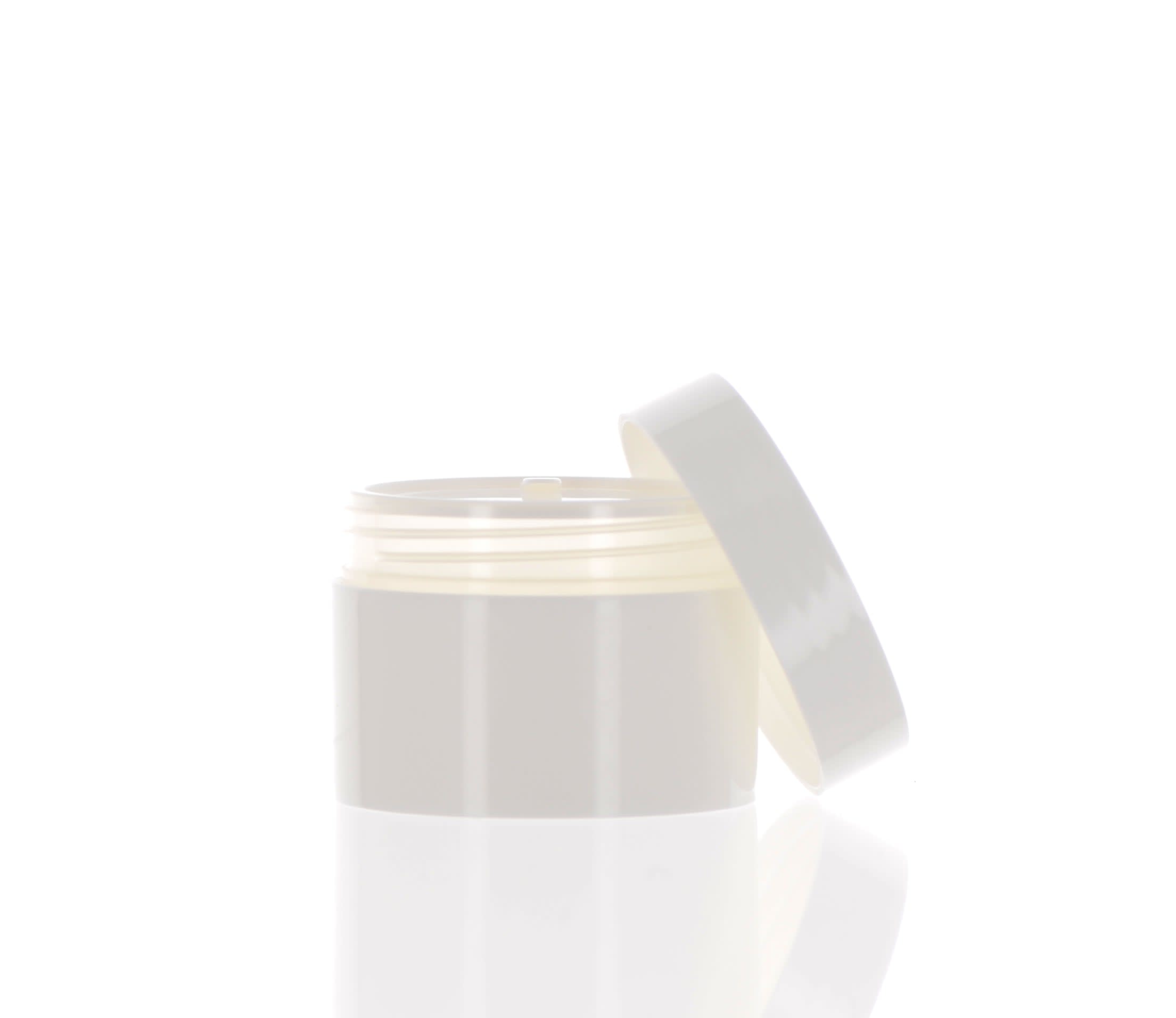 The image shows a small, clear jar with a white screw-on lid. The jar is identified as the "APG Packaging 0.2oz Mixed Material Jar APG-K5." The jar is empty and has a simple, clean design, suitable for holding small quantities of cosmetic or skincare products. The transparent body of the jar allows the contents to be visible, while the white lid provides a secure closure.