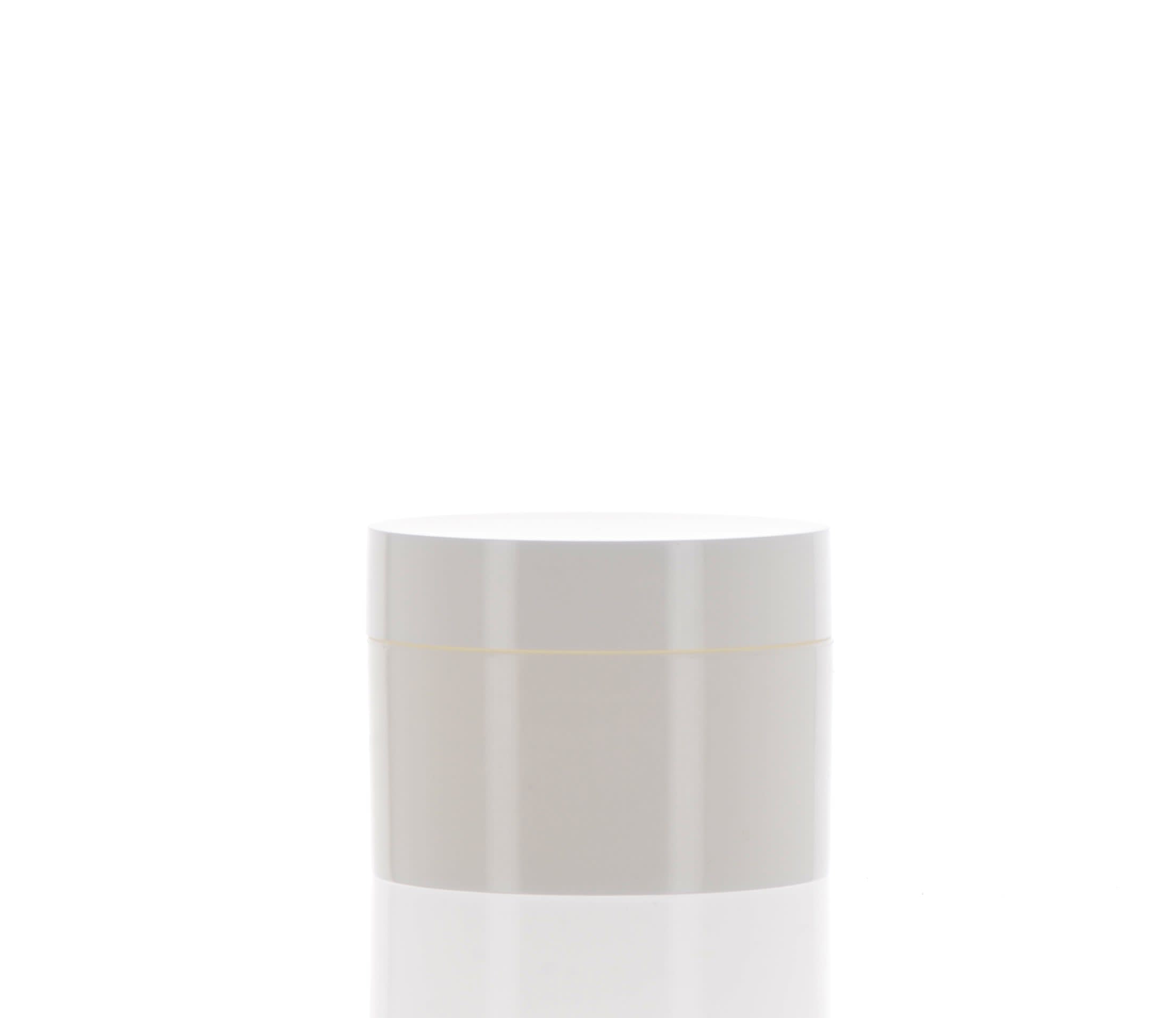 The image shows the APG Packaging 0.2oz Mixed Material Jar (APG-K5). This small, clear cylindrical jar features a white screw-on lid. The jar is empty and designed to hold cosmetic or skincare products. The transparent body allows visibility of the contents inside, while the white lid provides a clean and simple look. The overall design is compact and minimalistic, ideal for travel-sized portions.