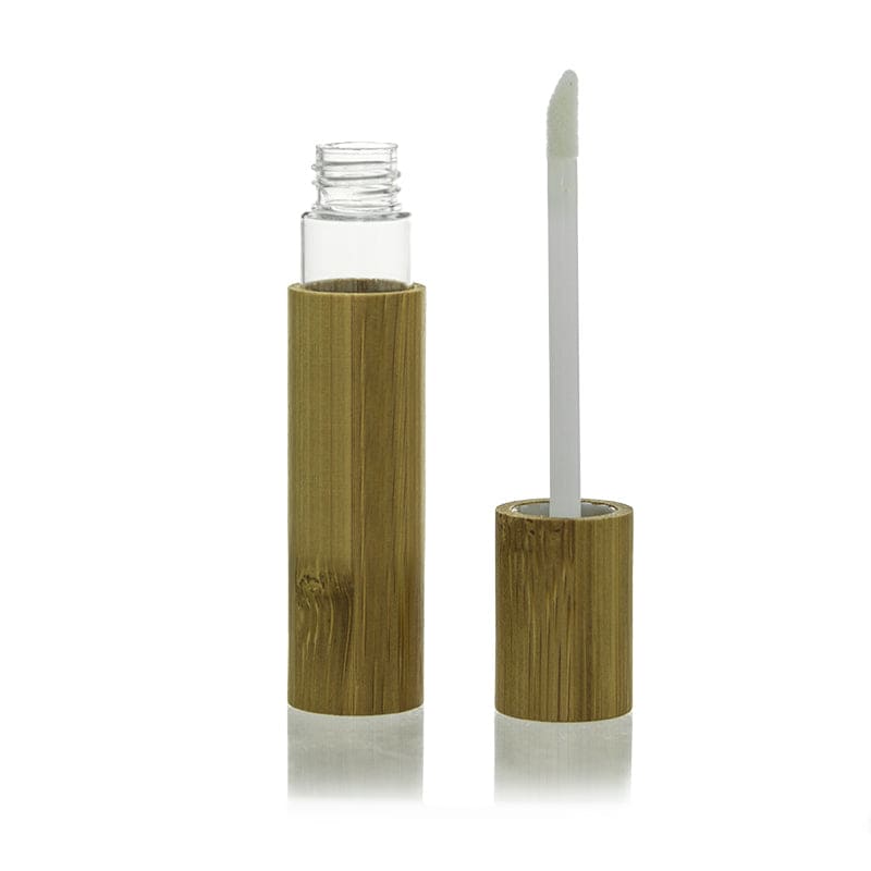 The image shows the APG Packaging 0.3oz Mixed Material Lip Gloss Tube (APG-LG233-10). The lip gloss tube features a clear cylindrical body, allowing the product inside to be visible. The cap is metallic and has a sleek, shiny finish. The applicator wand is attached to the cap, and appears to be a standard doe-foot style, suitable for precise application of the lip gloss. The overall design is elegant and practical, making it easy to see the remaining product and apply it smoothly.