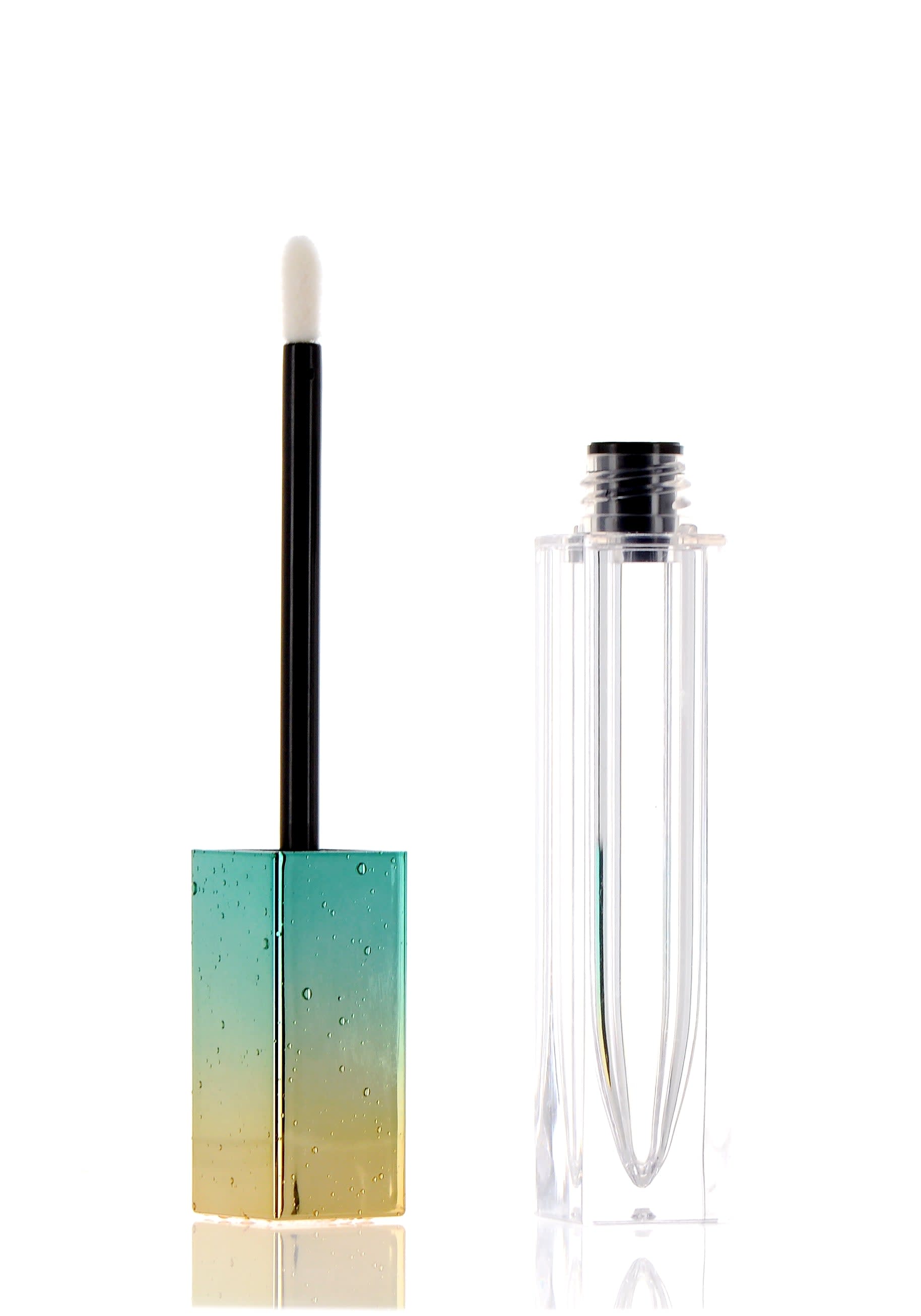 The image shows the APG Packaging 0.2oz Mixed Material Lip Gloss Tube (APG-G355-7). The lip gloss tube features a sleek, cylindrical design with a clear body, allowing the product inside to be visible. The tube is topped with a shiny, metallic cap, adding a touch of elegance to the overall appearance. The applicator wand is inserted into the tube, ready for use. The design is simple yet stylish, suitable for cosmetic use.