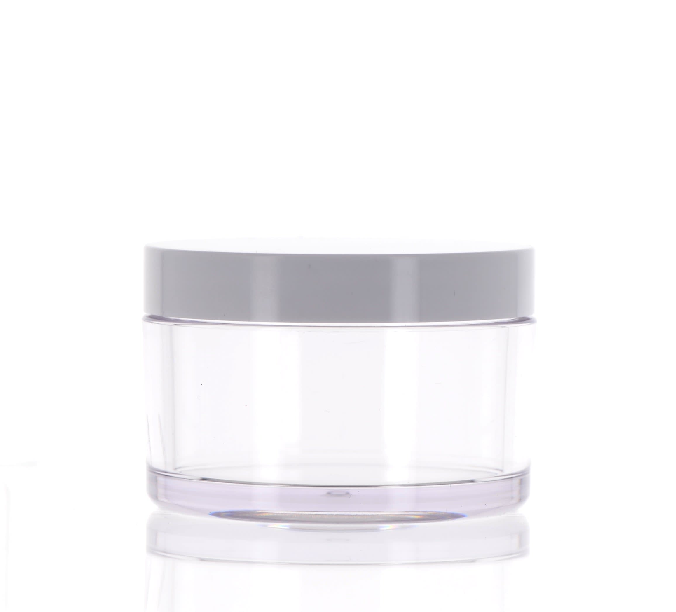 The image shows the APG Packaging 6.1oz Mixed Material Jar (APG-17-165-CW-180). The jar has a sleek, cylindrical shape with a smooth, opaque white body. It features a contrasting glossy black screw-on lid, which adds a modern and elegant touch to its design. The jar is designed to hold 6.1 ounces of product and appears to be suitable for various types of creams, lotions, or other cosmetic products. The overall look is clean and minimalist, making it an attractive option for packaging.