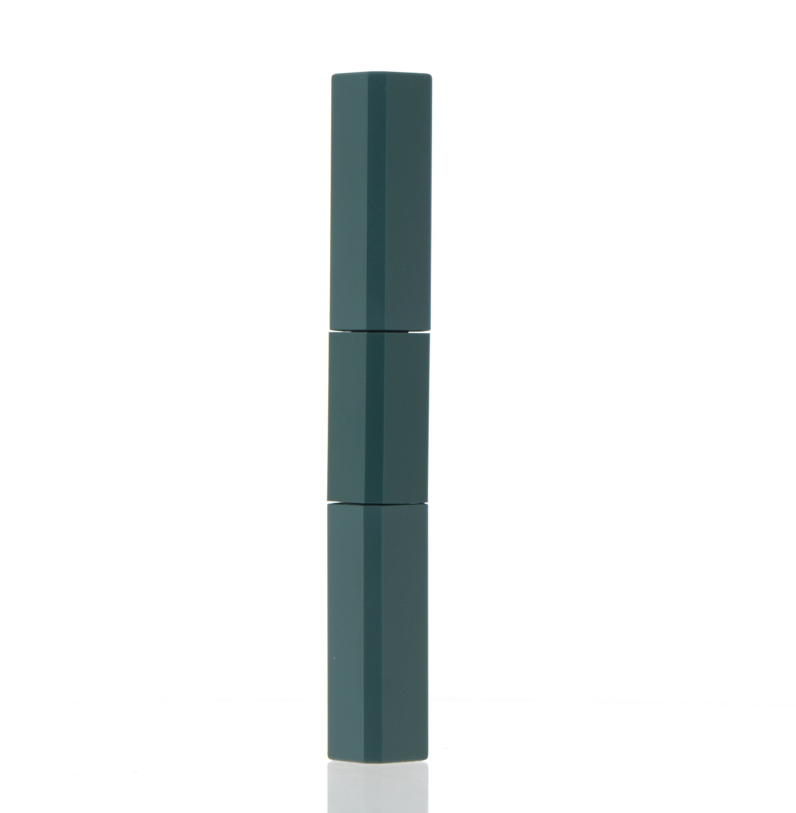 The image shows the APG Packaging 0.3oz Mixed Material Mascara Tube (APG-JA0440-5ML). The mascara tube features a sleek, cylindrical design with a glossy black finish. The cap is also black and has a smooth, rounded top. The tube appears to be made of different materials, giving it a sophisticated and modern look. The overall aesthetic is elegant and minimalistic, suitable for a high-end cosmetic product.