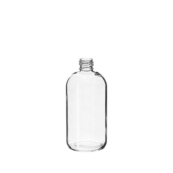 The image displays the Calaso 16.9oz Glass Bottle. It is a clear, cylindrical glass bottle with a smooth surface and a narrow neck. The bottle is empty, showcasing its transparent quality, and it has a slightly rounded shoulder leading up to the opening. The base is flat, allowing it to stand upright. The overall design is simple and elegant, ideal for storing liquids.