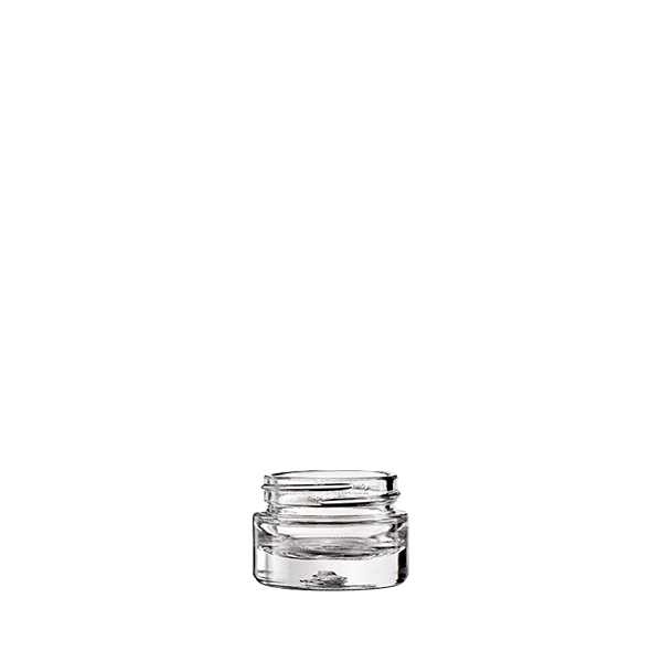 The image shows a clear, cylindrical glass jar with a smooth, seamless design. The jar has a wide opening and a flat base, making it suitable for various contents. This product is the Calaso 0.5oz Glass Jar. The clean lines and transparent nature of the glass highlight its simplicity and versatility.