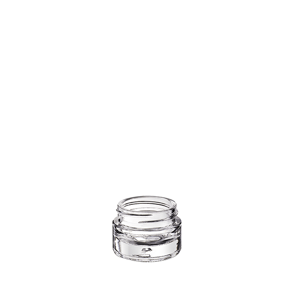 The image shows the Calaso 0.5oz Glass Jar. It is a small, cylindrical glass container with a clear, transparent body and a smooth, even surface. The jar is topped with a simple, flat, screw-on lid, which is also transparent. The overall design is sleek and minimalistic, ideal for holding small amounts of products. The jar is placed against a plain white background, highlighting its clarity and clean lines.