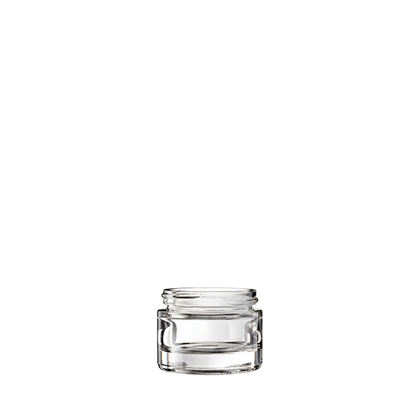 The image displays the Calaso 1.0oz Glass Jar, model HD14150-100. The jar is clear and cylindrical with smooth, straight sides and a flat, round base. The jar has a wide mouth, making it suitable for easy filling and dispensing of contents. The glass appears to be thick and sturdy, providing a high-quality look and feel to the product. There is no lid shown in the image. The overall appearance is sleek and minimalist, ideal for various uses such as cosmetics, creams, or other small quantities of products.