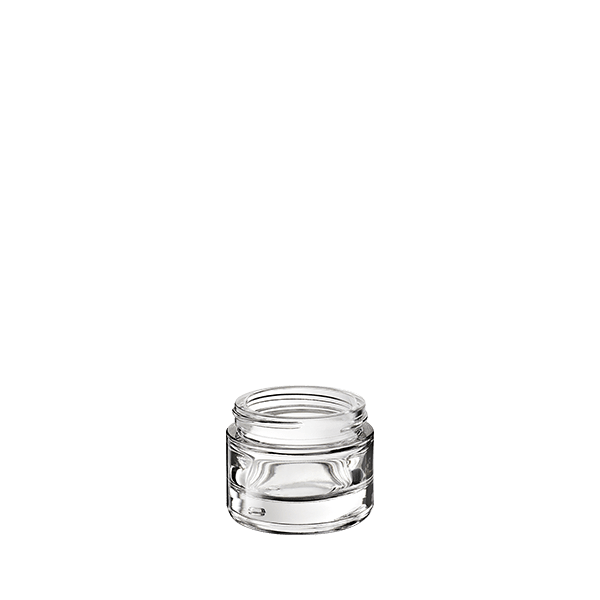 The image shows the Calaso 1.0oz glass jar. The jar is clear and cylindrical with a wide opening, making it suitable for storing creams, lotions, or other similar products. The glass has a smooth surface, and the jar appears to have a thick base, giving it a sturdy look. The jar is empty and does not have any labels or markings on it.