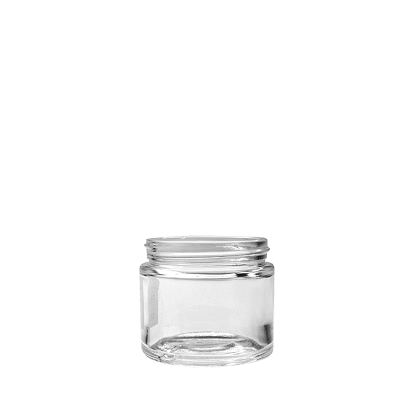 The image shows the Calaso 3.4oz Glass Jar. It is a small, clear glass jar with a round shape and a wide mouth. The jar's body is smooth and transparent, allowing the contents to be easily visible from the outside. The opening is fitted with a threaded neck designed to accommodate a screw-on lid, which is not shown in the image. The simple and sleek design of the Calaso 3.4oz Glass Jar makes it versatile for various storage purposes.