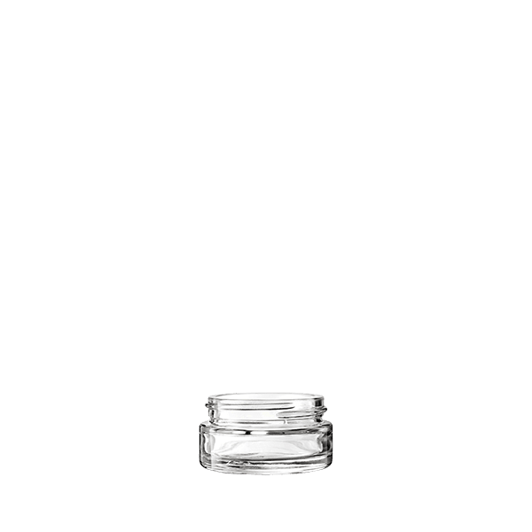 The image shows a clear, empty glass jar with a cylindrical shape. The jar has a smooth surface and a wide mouth with a threaded neck designed for a screw-on lid, which is not shown in the image. The glass is transparent, allowing full visibility of its contents. This product is identified as the "Calaso 1.0oz Glass Jar."
