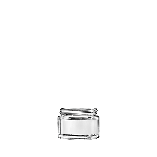 The image shows the Calaso 1.7oz Glass Jar by Glasmeister. The jar is clear and cylindrical with smooth, slightly rounded edges. The glass is transparent, allowing the contents inside to be visible. The jar features a wide mouth opening, suitable for easy filling and dispensing of products. The overall design is sleek and minimalist, making it ideal for a variety of uses such as cosmetics, creams, or other small items.