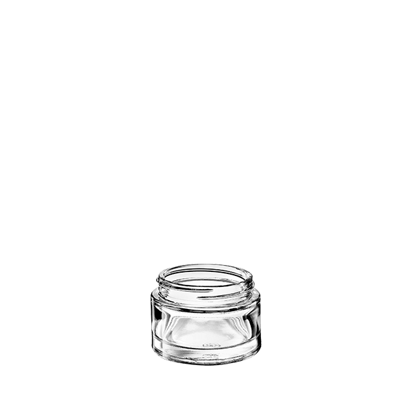 The image shows the Calaso 1.7oz Glass Jar by Glasmeister. The jar is transparent, cylindrical in shape, with a smooth, flat base and a wide, round opening at the top. It appears to be made of high-quality clear glass, showcasing a simple and elegant design. The jar is empty, and no lid is visible in the image.