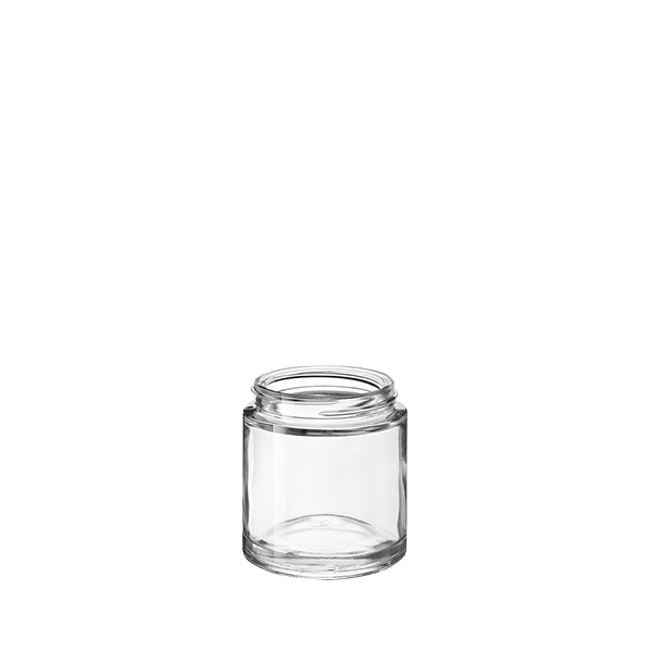 The image shows the Calaso 3.4oz Glass Jar HD13095-100. The jar is transparent and cylindrical with a smooth, seamless surface. It has a wide mouth, which is suitable for easy filling and access. The jar sits on a flat base, providing stability. The glass appears thick and durable, suitable for containing various substances securely.