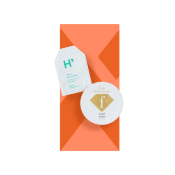 The image features the Expack 0.03oz PE Standup Pouch PCR UniShape Die-Cut 1.0ml. The pouch is small and sleek, with a clear, flexible design that allows the contents to be visible. It has a die-cut shape which gives it a unique and professional appearance. The standup pouch is displayed against a plain white background, highlighting its structure and form. The top of the pouch appears to be sealed, while the bottom expands to provide a stable base for standing upright.