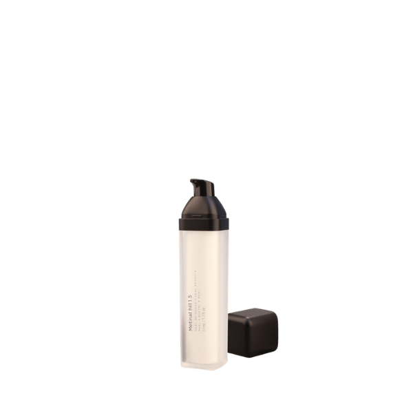 The image shows a Garrett Hewitt International 1.0oz PMMA Airless Bottle. The bottle is transparent, allowing the viewer to see the product inside. It features a sleek, cylindrical design with a smooth, clear exterior. The bottle has a silver pump dispenser at the top with a matching silver collar, providing a modern and elegant appearance. The overall design suggests a high-quality, upscale packaging solution suitable for cosmetic or skincare products.