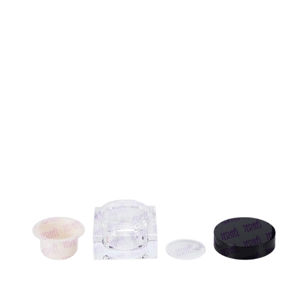 The image shows a 1.0oz jar by Jerhel Plastics Inc. The jar is made of clear plastic with a white screw-on lid. The simple, cylindrical design is suitable for storing creams, lotions, or other small quantities of cosmetic or personal care products. The transparent body allows for easy viewing of the contents inside.