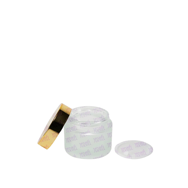 The image shows a clear, cylindrical glass jar with a silver screw-on lid. The jar is empty and has a smooth, polished surface. The product is the 1.7oz Glass Jar (JI-2188) by Jerhel Plastics Inc.