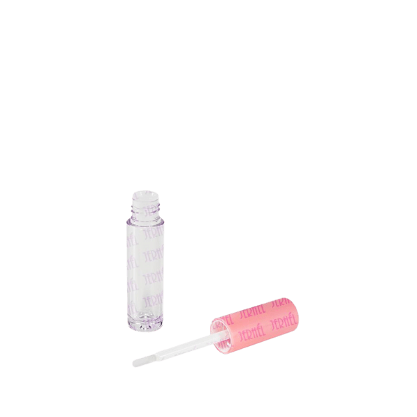 Image of Jerhel Plastics Inc. 0.1oz Lip Gloss Tube. The tube is transparent, showcasing its sleek and simple design. It features a clear body with a smooth cylindrical shape and a small, rounded cap at the top. The cap appears to be a twist-off design, ensuring the product inside is securely contained. The overall look is minimalistic and practical, suitable for holding a small amount of lip gloss.