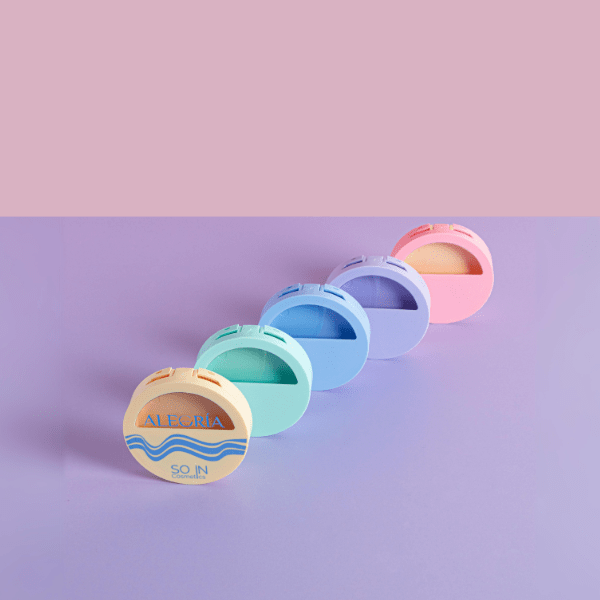 The image features the SIMEX 0.0oz ABS Compact (ES003). It is a small, circular compact case with a smooth, flat lid. The compact has a minimalist design, primarily in a solid color, and includes a hinge on one side for opening and closing. The interior is designed to hold a cosmetic product, typically a pressed powder or similar item. The compact appears sleek and modern, suitable for carrying in a purse or makeup bag.