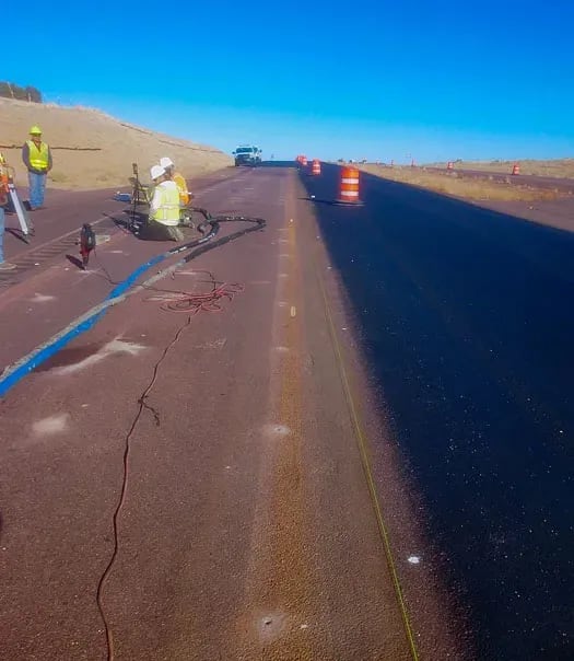 Roadway in Mexico with crewmembers working in background