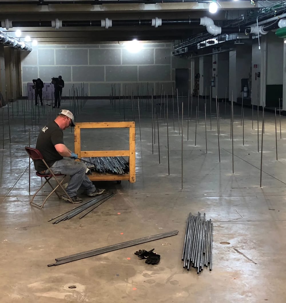 Technician seated in Field Museum worksite