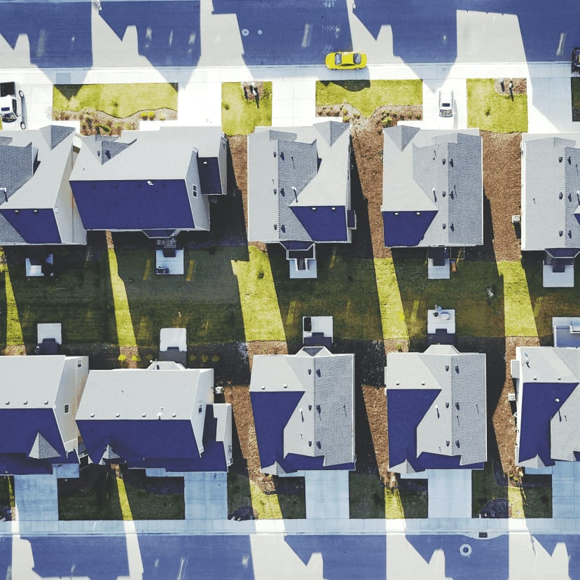 Aerial shot of residential street with driveways and street