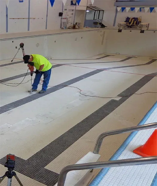 URETEK technicians preparing lap pool for work