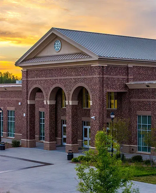 Exterior of brick, arched building