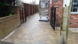 Finished driveway in tobermore tegula trio boarder colour charcoal tegula and main insett is cedar colour