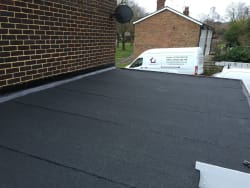 Installing a 3 layer high performance felt system on a flat roof in Kent