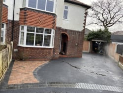 Tarmac driveway with brick border and paving 