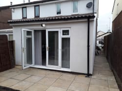 New single story extension built finished with k -rend .new pvc facias soffits and gutterint front side and rear . New footings laid and new patio laid .also new fence on side