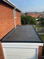 New fire  stone rubber roof on garage 