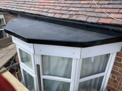 New for stone rubber roof on bay window 