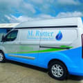 M.Rutter Plumbing and Heating Logo