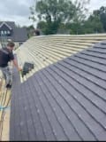 Total Roofing Contractors logo