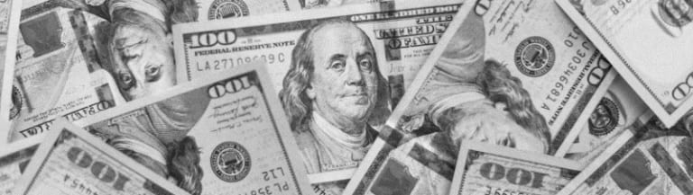 pile of US 100 dollar bills