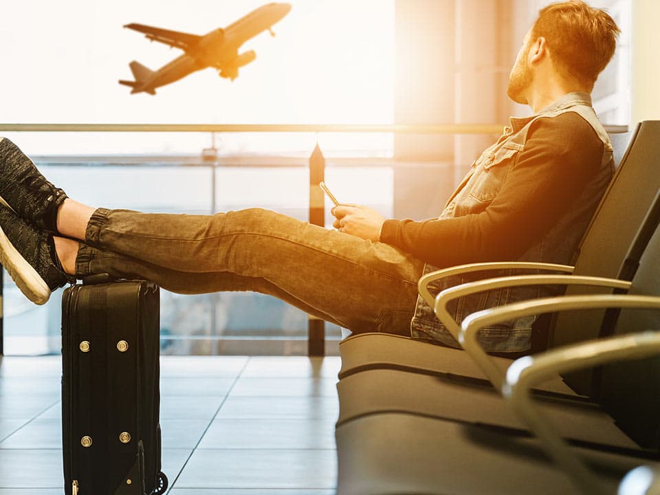 Man sitting at an airport