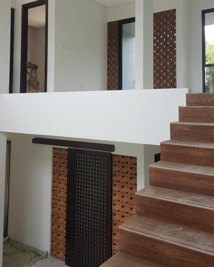 The implementation of minimalist $breeze$ $block$ on the facade of modern house architecture provides optimal ventilation and creates an aesthetically pleasing decorative roster.