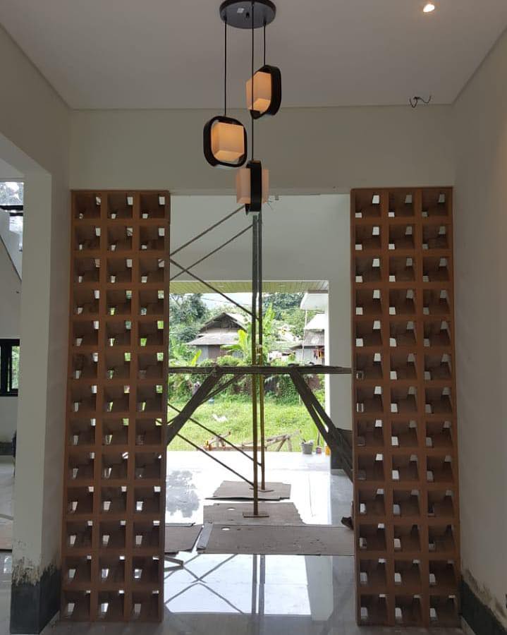 The implementation of minimalist $breeze$ $block$ on the facade of modern house architecture provides optimal ventilation and creates an aesthetically pleasing decorative roster.