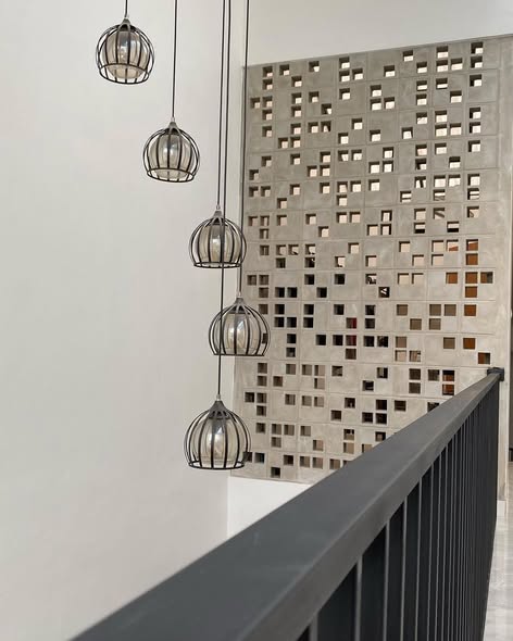 The implementation of minimalist $breeze$ $block$ on the facade of modern house architecture provides optimal ventilation and creates an aesthetically pleasing decorative roster.